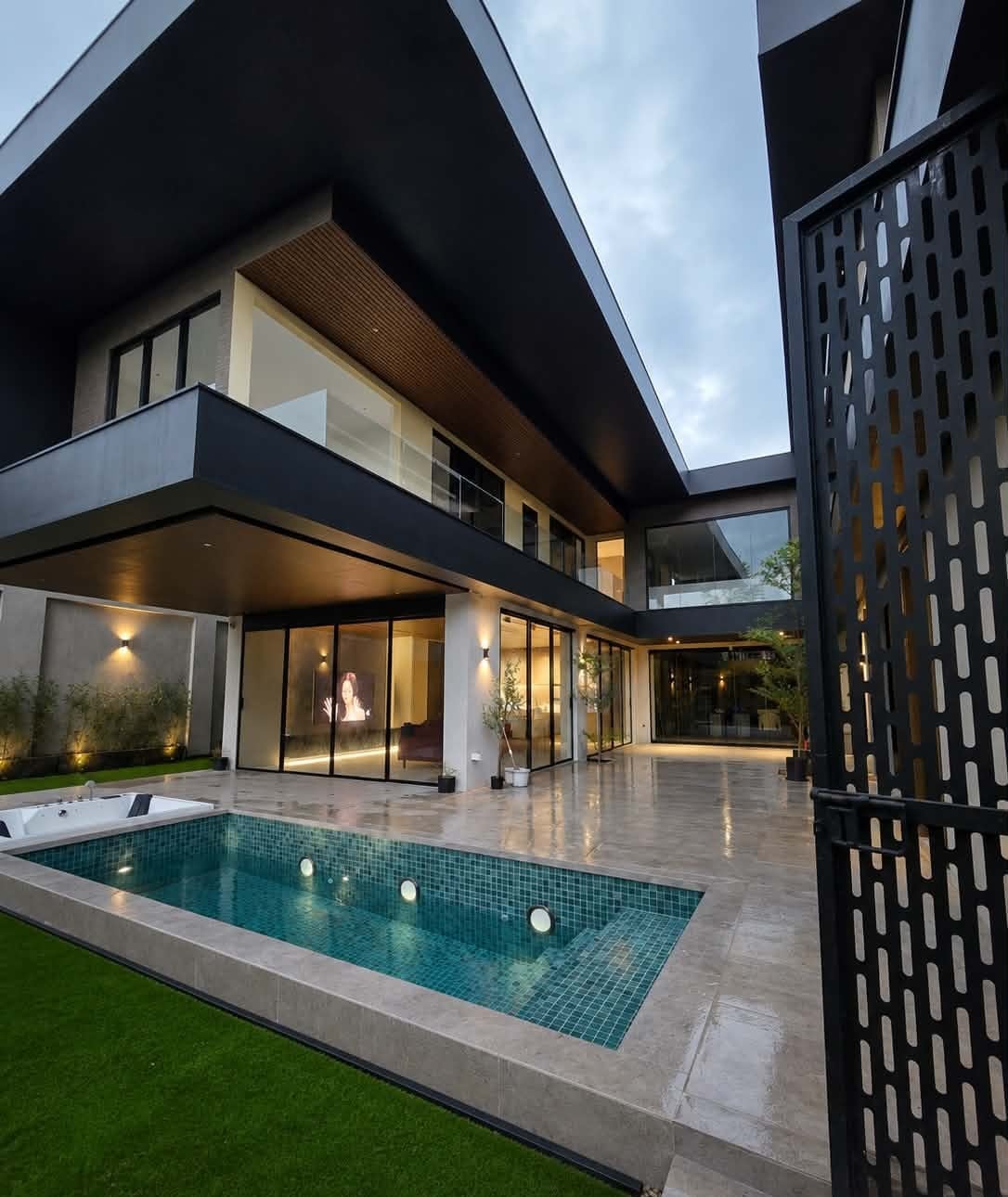 The pool and lawn beside the villa